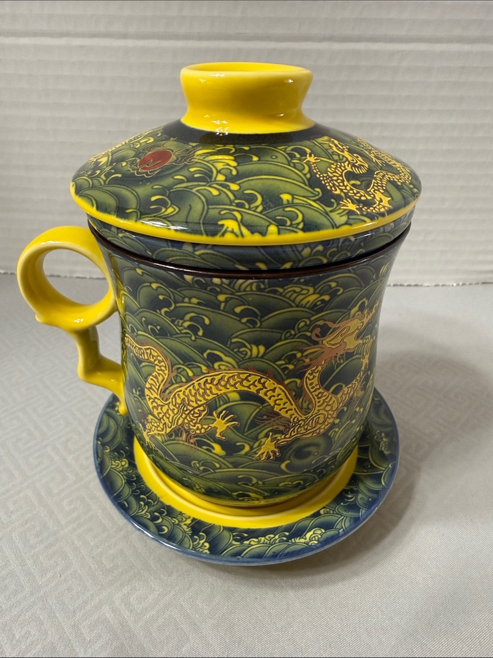 Porcelain Tea Cup Set Lid Saucer and Infuser Chinese Dragon Motif Yellow & Green